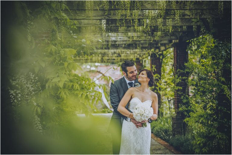 62d36eec a424 4423 a76d 9571fa9a30df Marta  bride and groom in wisteria walkway 768x513