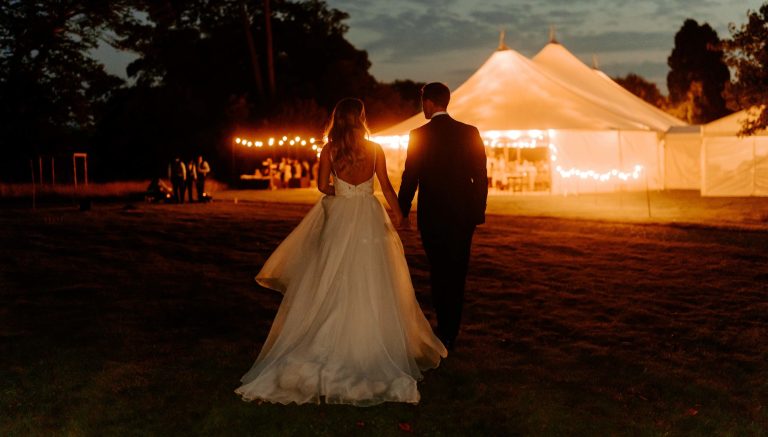 Bignor Park Weddings Greek Loggia Formal Gardens reception at night 2700x1536 1 768x437