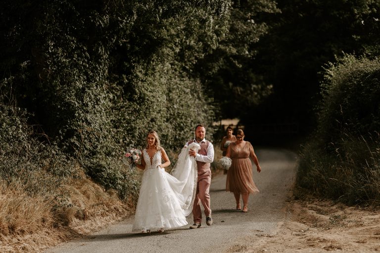 Countrylanewithbridesmaids 768x511