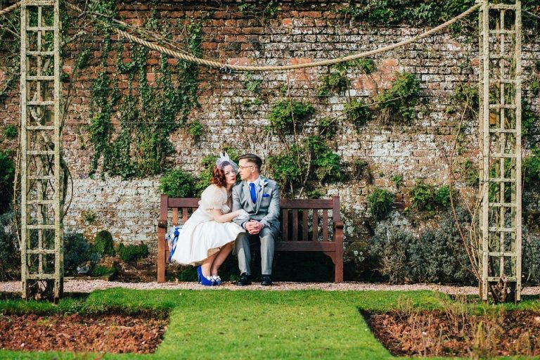 Wedding Elopement Photography at Cockington Court Torquay Devon 0014 eloping couple sitting on bench at cockington court rose garden modern star crossed lovers look eghi4s 768x512