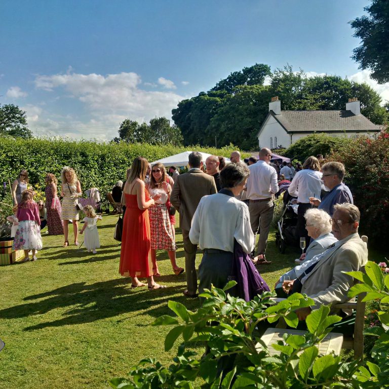 Wedding guests on the main lawn at Monks wnezi7 768x768