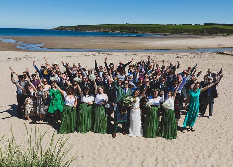 beachgroupwaving 768x549